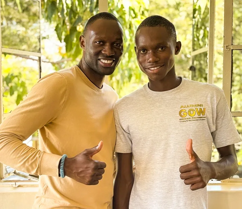 GOW alumnus who completed the student scholarships programme, giving a thumbs up